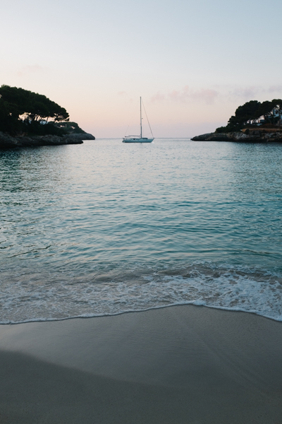 Yacht moored in a cove at sunrise